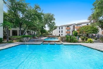 Resort-style pool with lounge seating